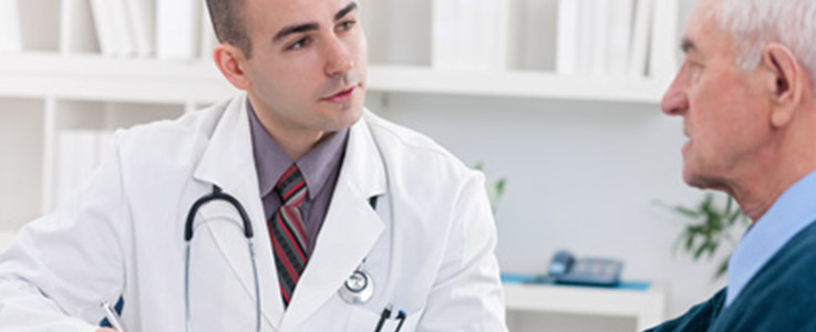doctor consulting retired man