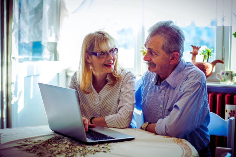 Older couple looking at a computer together
