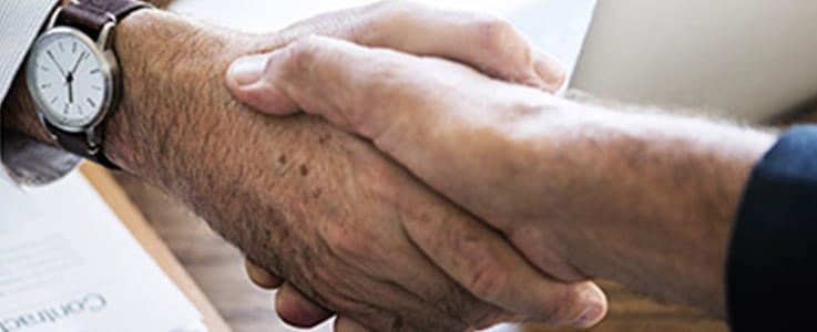 men shaking hands close up