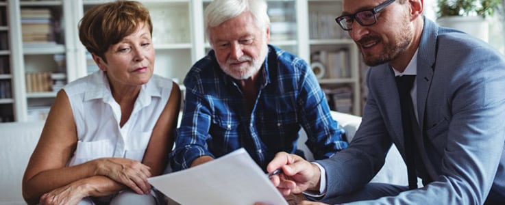 retired couple meeting with financial advisor