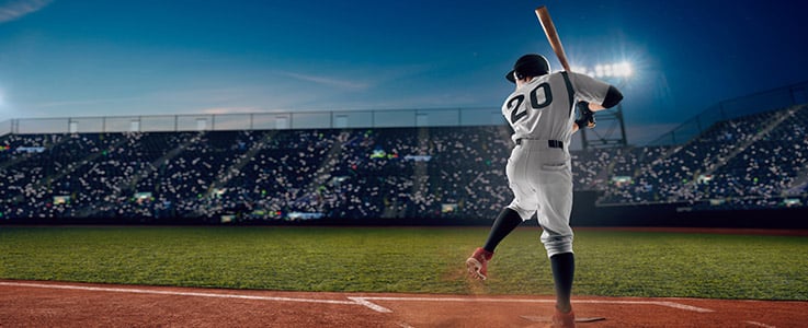 baseball player swinging at pitch