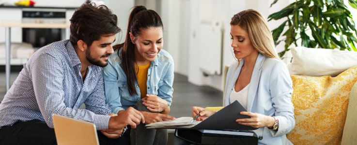 happy couple with financial advisor