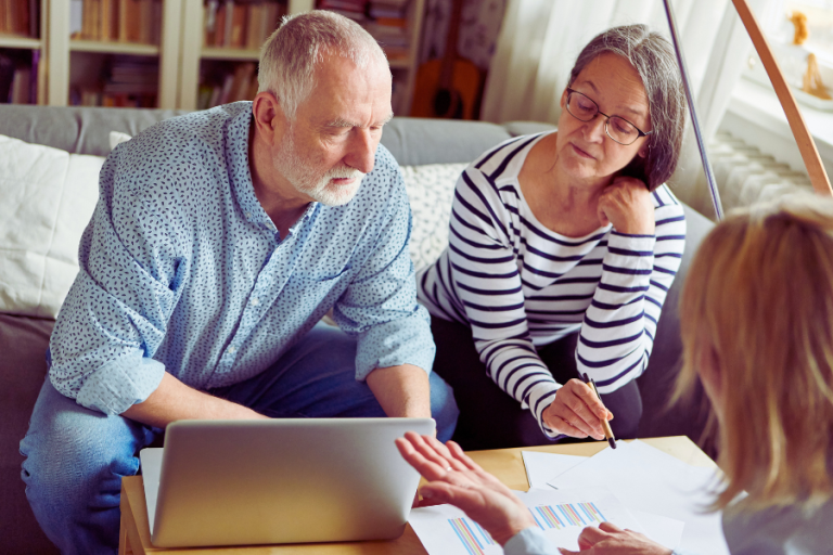 older couple discussing retirement options with an advisor