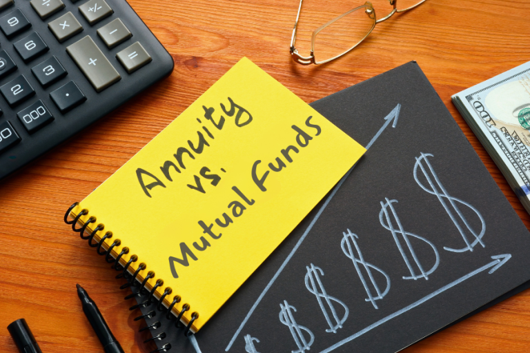 Notebook with 'Annuity vs Mutual Funds' written on a yellow page, placed on a wooden desk and a chart showing investment growth